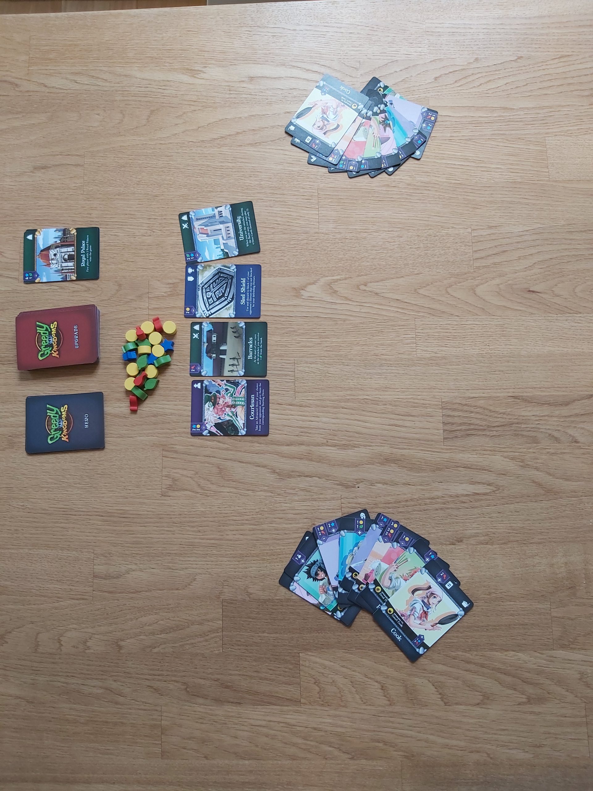 Zu sehen ist der Spielaufbau von Greedy Kingdoms