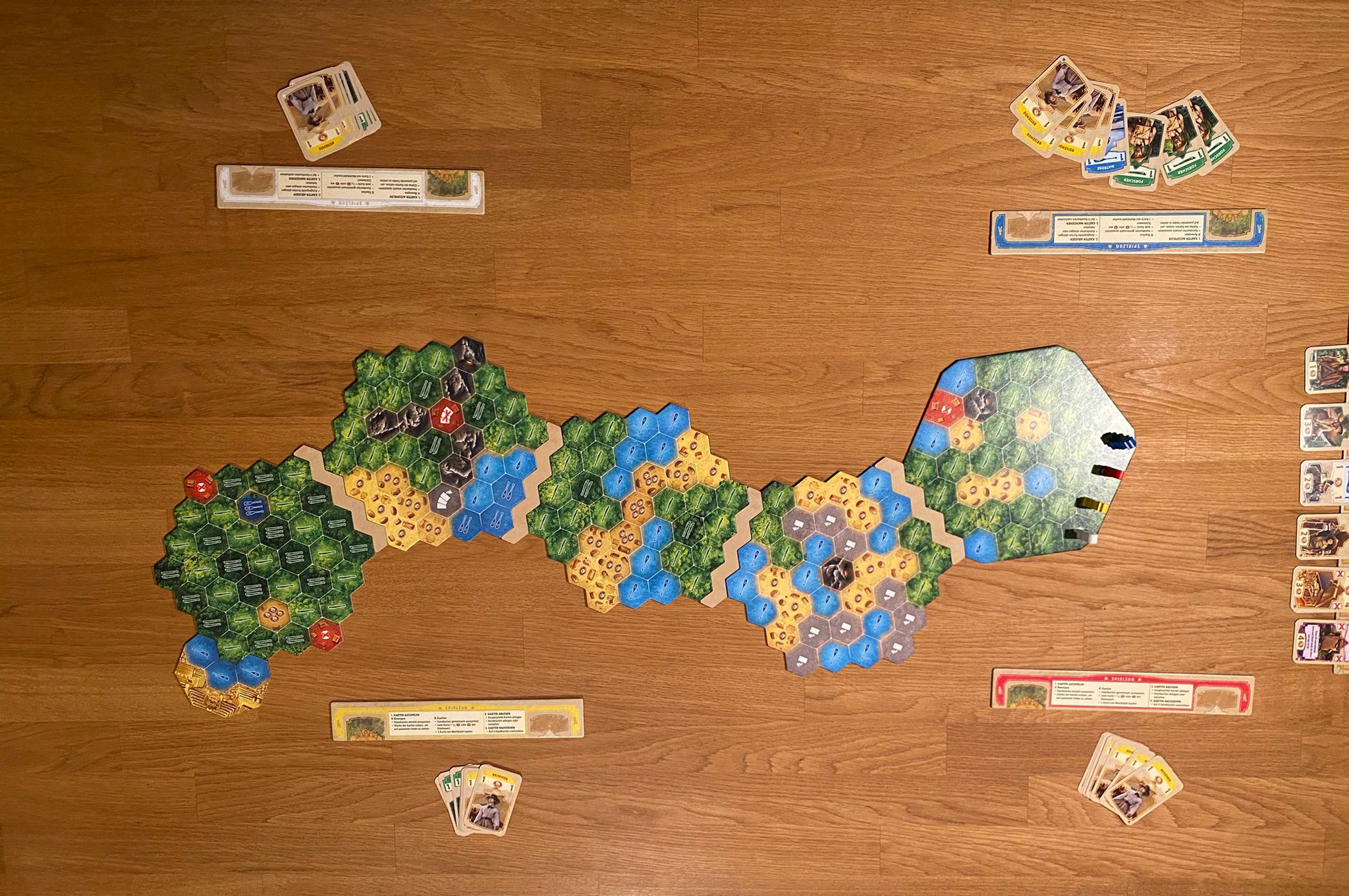 Der Spielaufbau für 4 Personen.