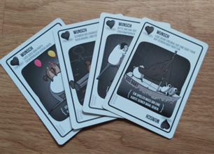 Zu sehen sind die Wunsch Karten von Explodding Kittens.