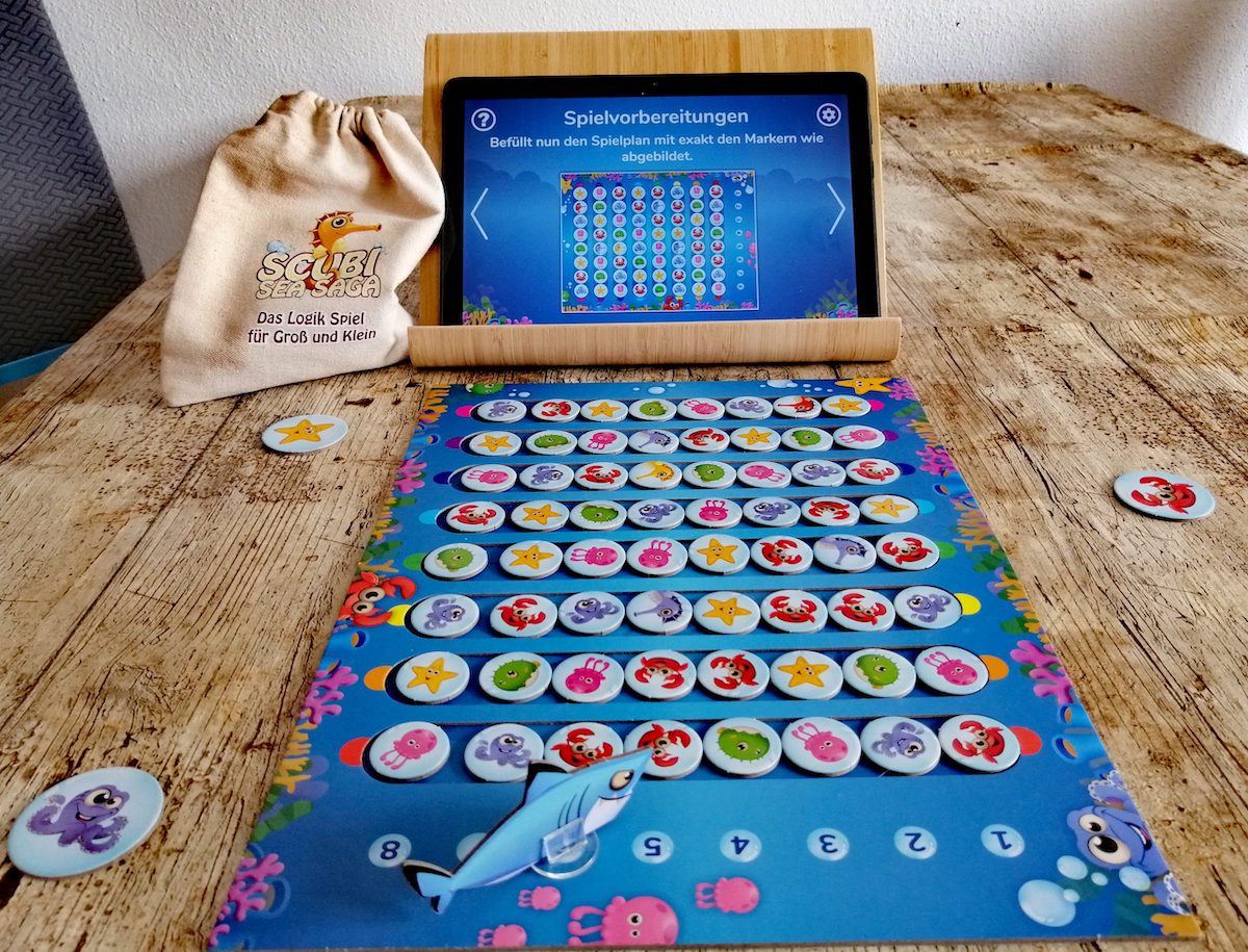 Spielaufbau. Die Plättchen müssen wie angegeben gelegt werden.