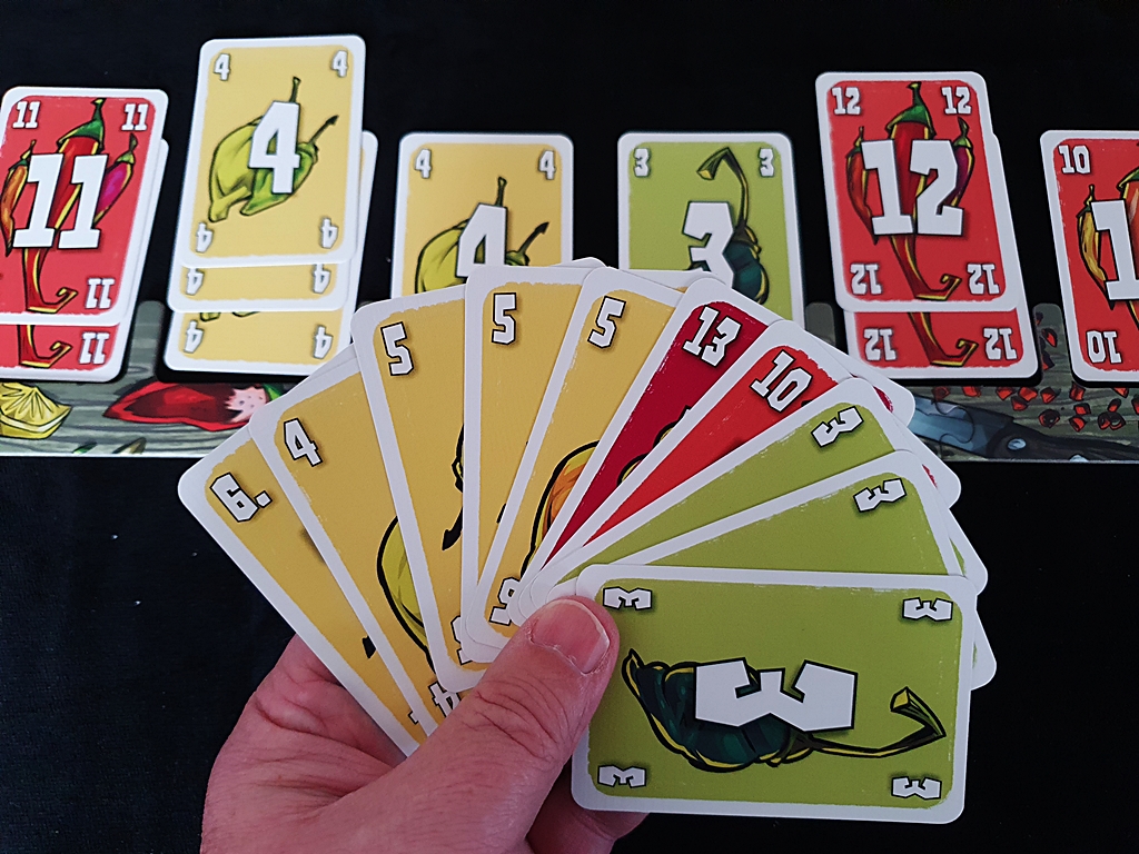 Kartenhand eines Spielenden