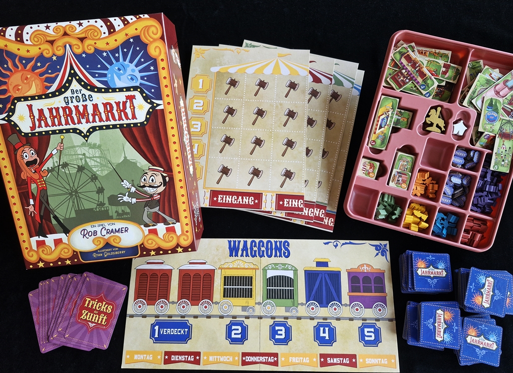 Spielkarton und Inhalt. Das kleinteilige Material ist in einem Inlay untergebracht.