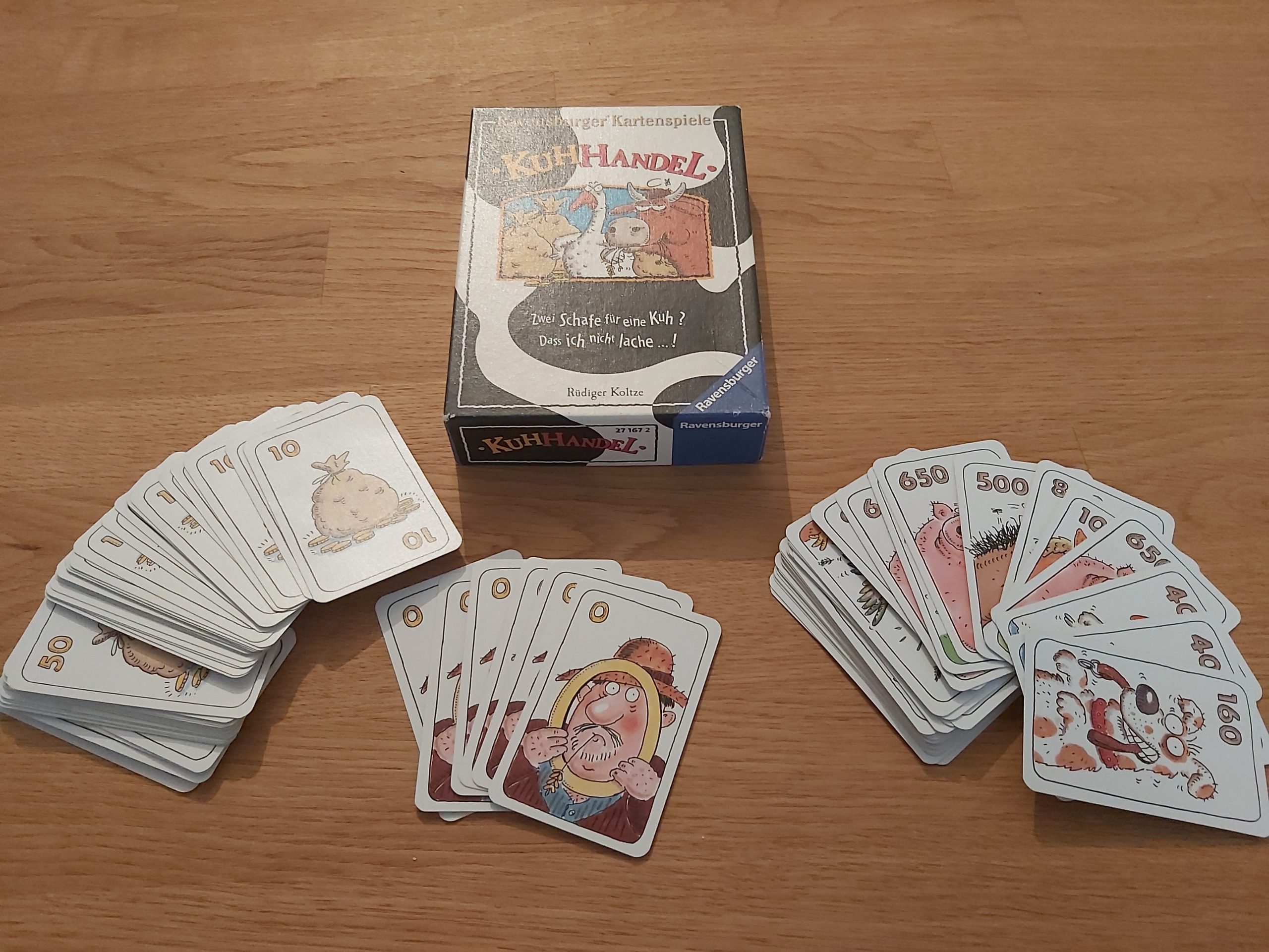 Zu sehen ist das Spiel Kuhhandel mit allen Spielkarten