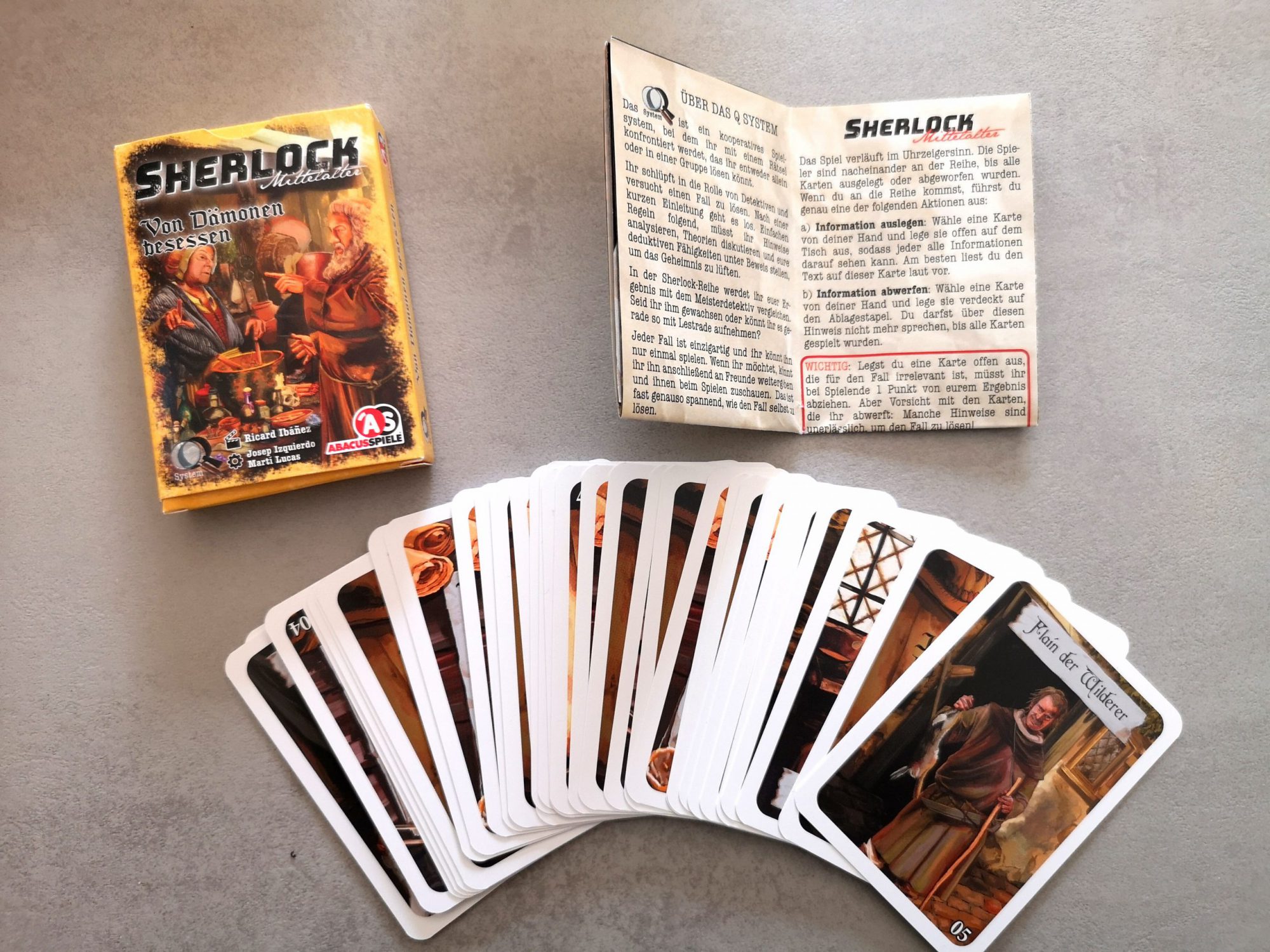 Spielbox mit Anleitung und Karten