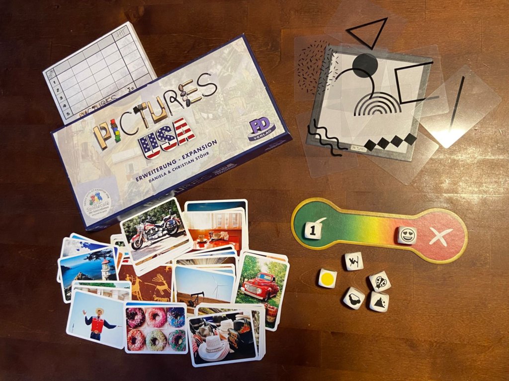 Bildkarten mit Fotos, Würfel mit besonderen Motivenund eine Temperaturleiste, durchsichtige Karten mit grafischen Objekten